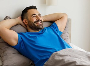 a man waking up and feeling rested