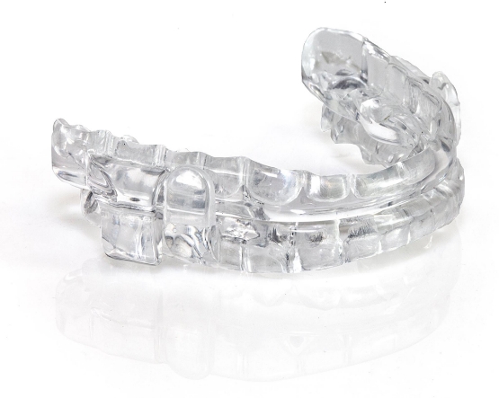 Clear oral appliance tray on white background