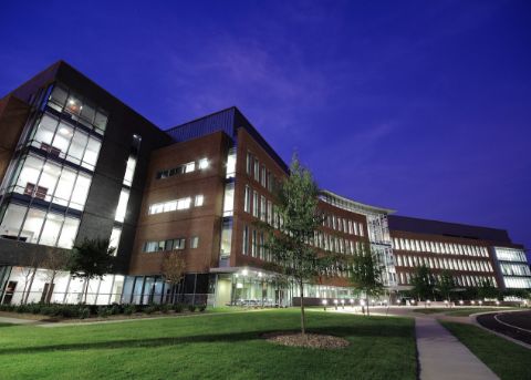 Exterior of multistoried university building at night