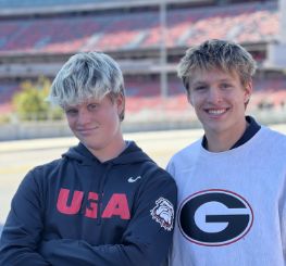 Doctor Braggs two teenage sons in football stadium