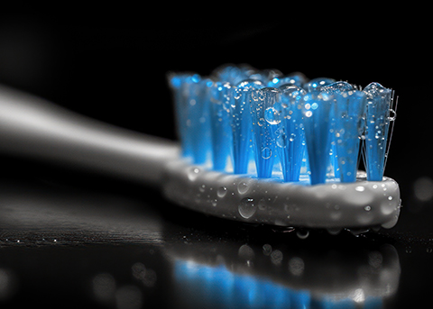 Close up of toothbrush with blue bristles