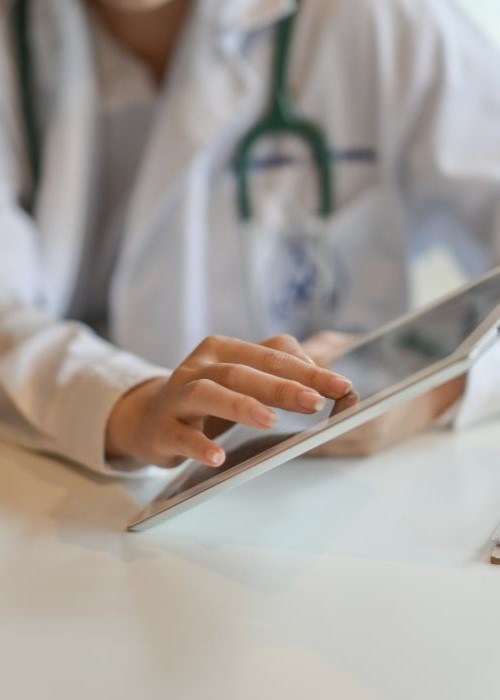 Sleep dentist showing a tablet to a patient