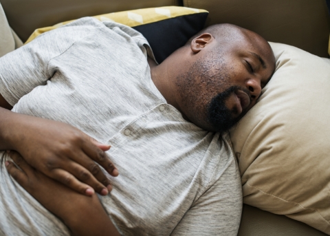 Man sleeping on his back