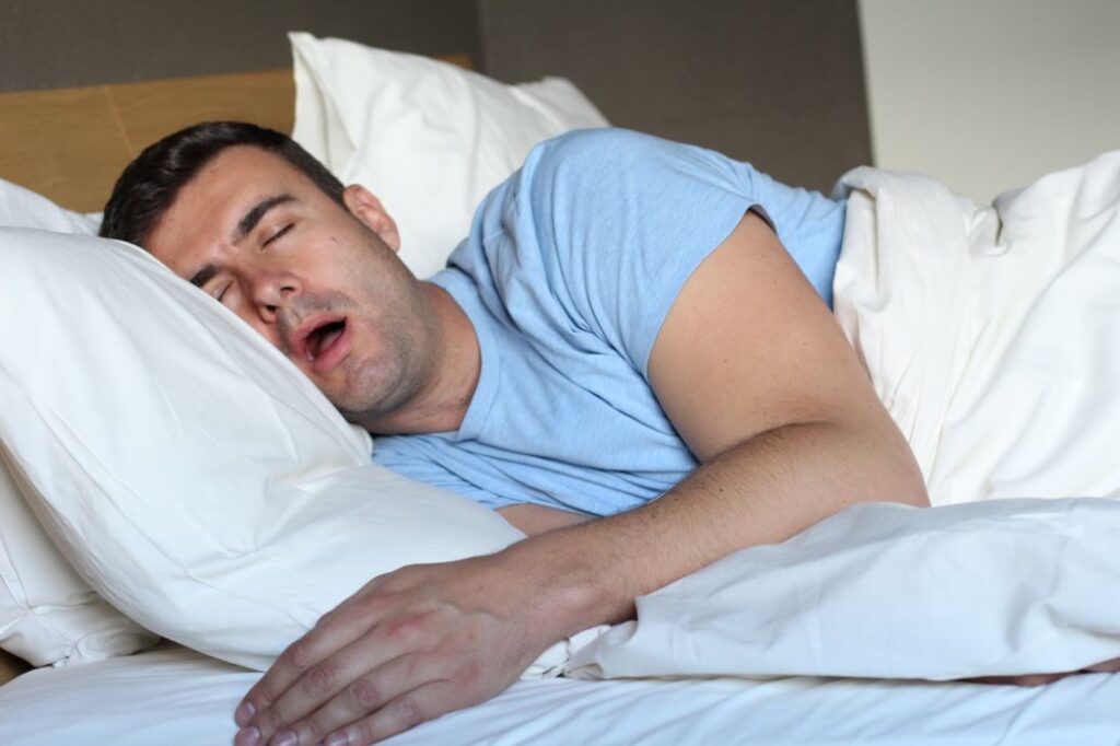 A man sleeping with his mouth open.